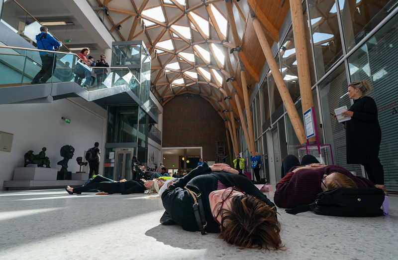 A ground perspective of people laying down in the main hall of Coventry's Herbert Art Gallery