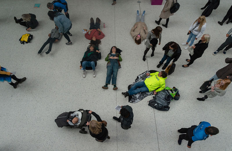 An aerial shot of people lying on the floor of the Herbert Art Gallery