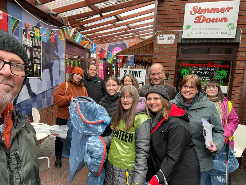 A group wearing hats and coats and all wrapped up ready for a litter pick in Ball Hill.