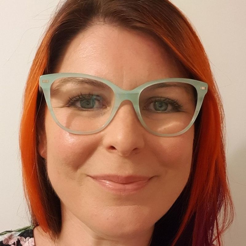 Jess Pinson from Grapevie is pictured wearing pale green glasses and with red hair