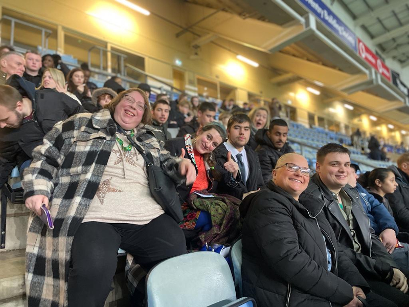 Part of the Grapevine group sitting in the stands at CBS Arena.